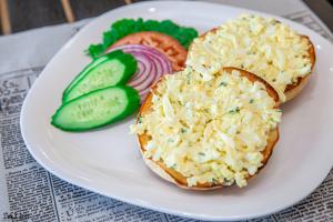 Open faced egg salad sandwichwith vegetables