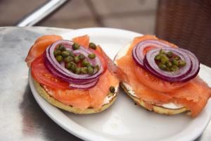 Open faced bagel lox cream cheese and vegetables